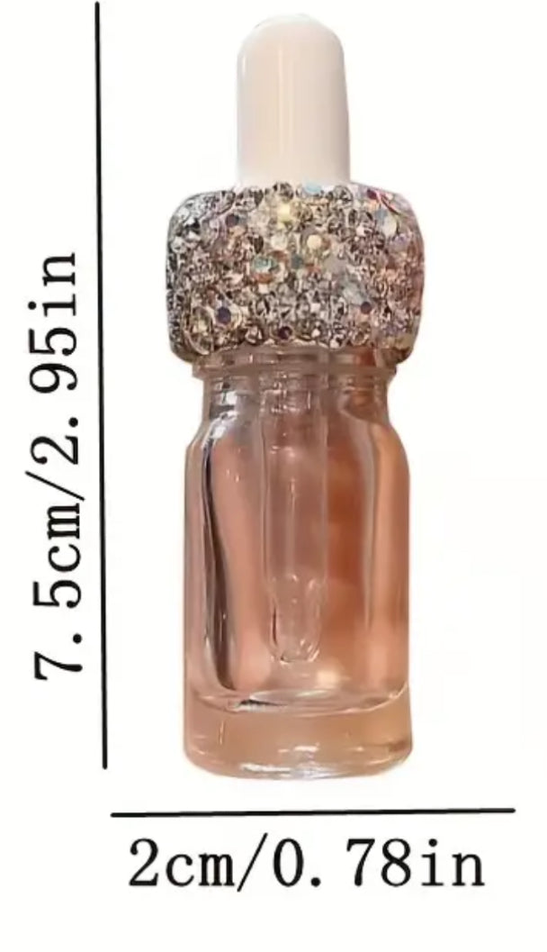 Rhinestone dropper for oil or perfume.