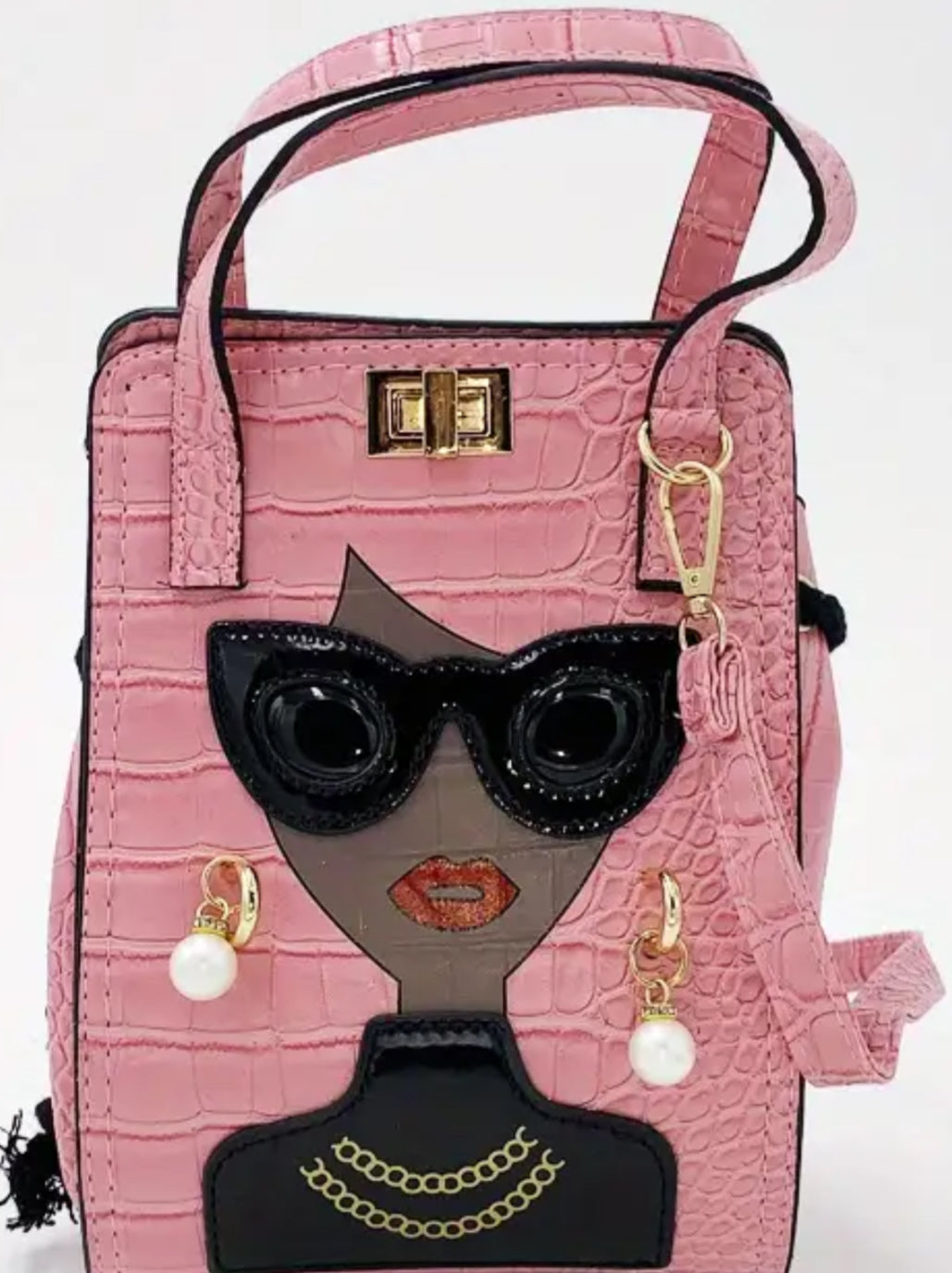 Chic women’s tote, with early and diamond sparkle earrings.