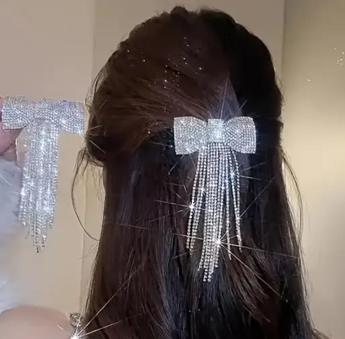 Beautiful bow hair clip with hang down sparkles.